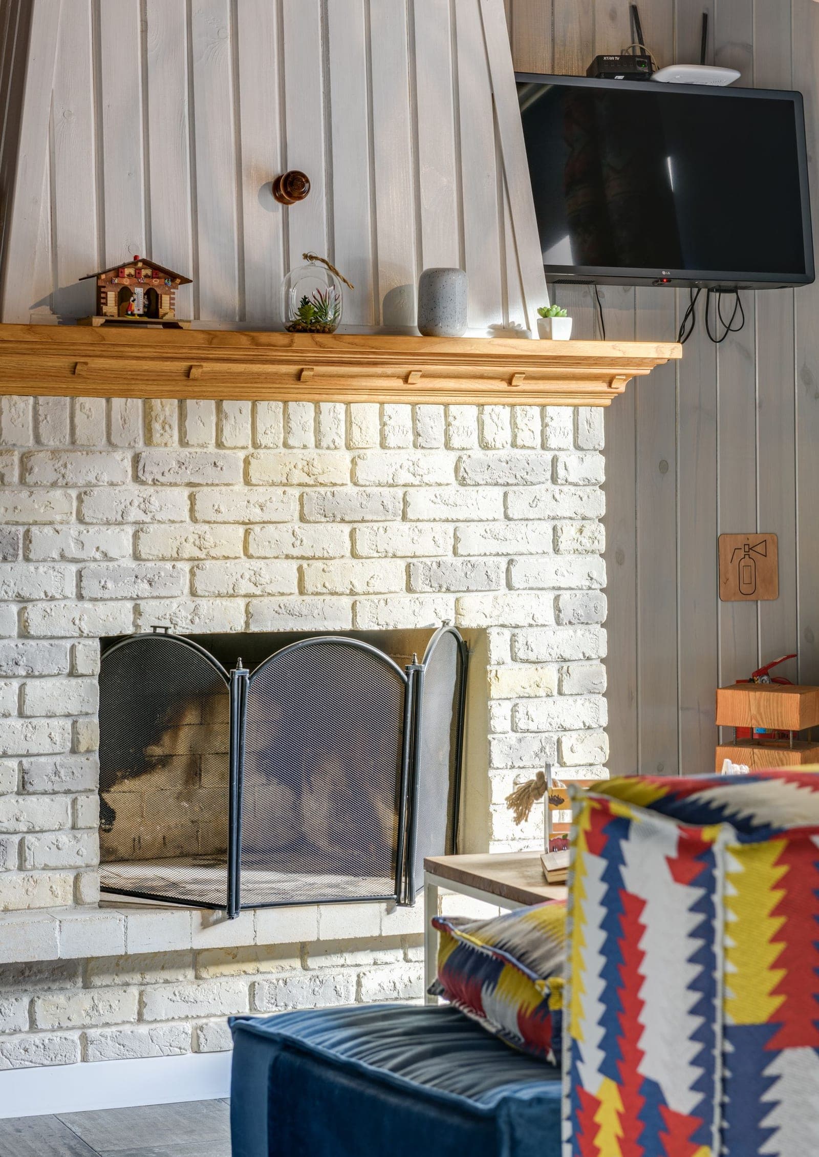 TV mounted on a brick accent wall