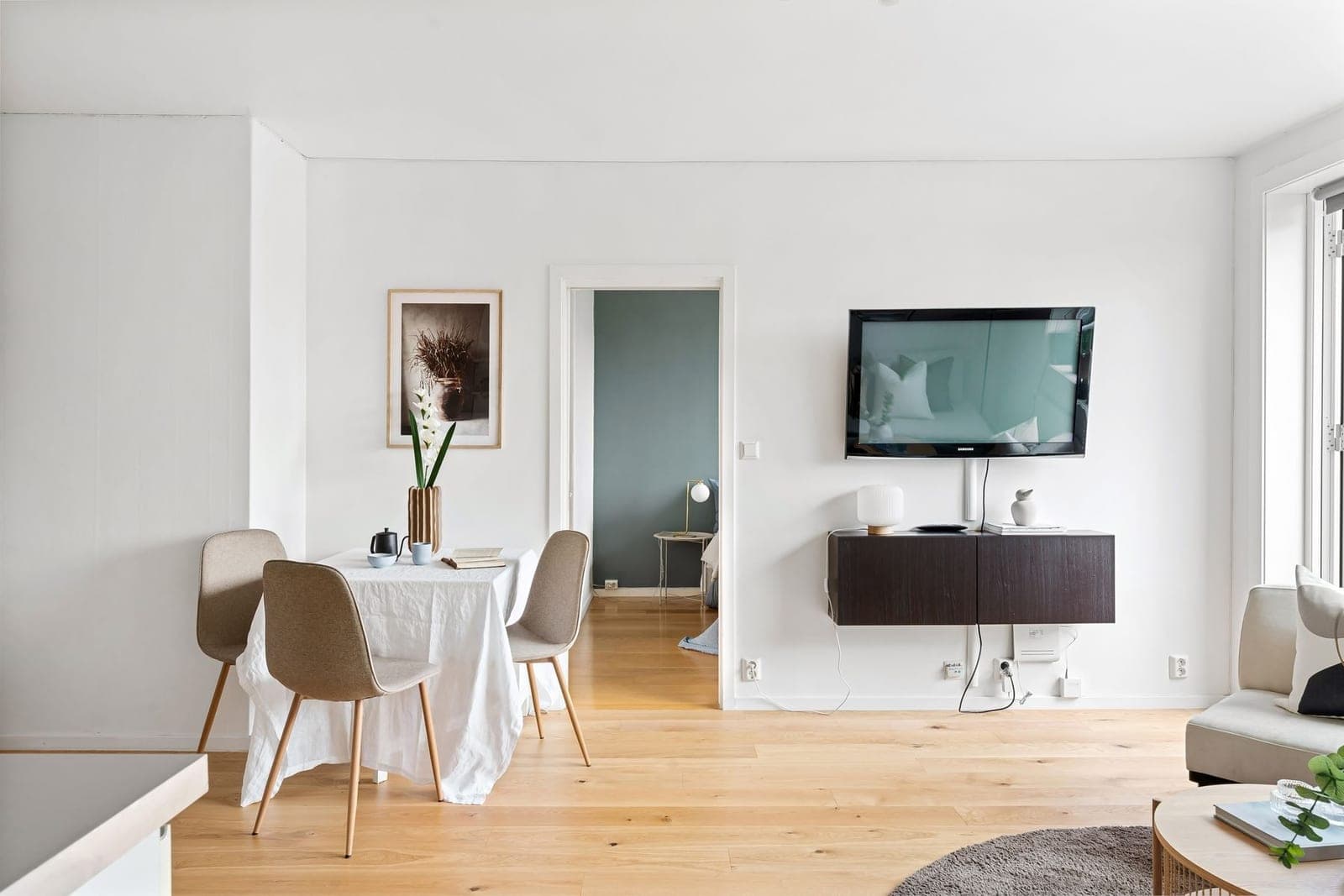 TV with soundbar mounted together on a wall